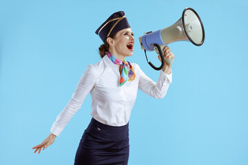 happy stylish stewardess woman on blue
