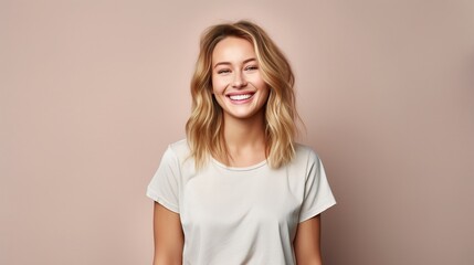 Happy blonde woman with a beautiful smile, posing in a studio, exuding happiness and fashion-forward charm
