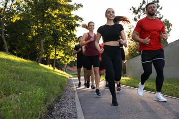 Obraz premium Group of people running outdoors. Active lifestyle