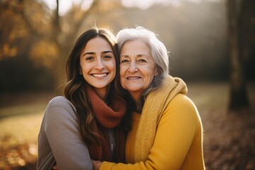 Naklejka premium Generative AI : A 50 years old mother and daughter, hugging, smiling
