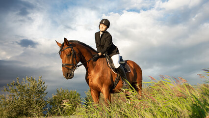 Horsewoman in equestrian sports gear, riding a horse, against an expressive sky, horseback riding...