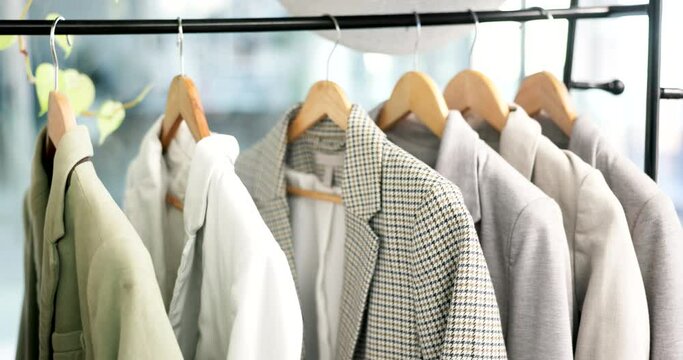 Fashion, rack and clothing line of empty boutique store for retail shopping, accessory or outfit choice. Room, shop or clothes and suits or fashionable attire for purchase, buying or discount sale