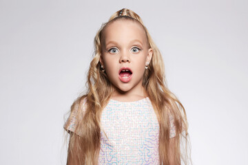 little girl in beautiful dress and make-up. Portrait of funny Child. Blonde - obrazy, fototapety, plakaty