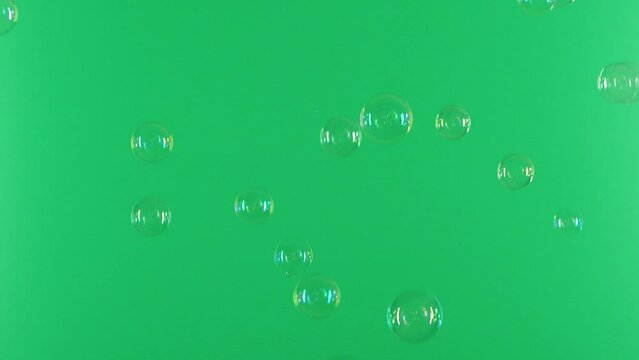 Slow motion of soap air bubbles texture on chroma key green screen background
