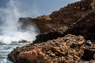 The turbulent sea with a sunny summer day on the island of Crete