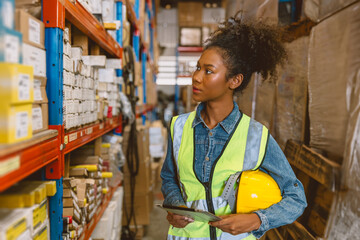 Woman teen worker African American black girl employee working in stock shelf warehouse checking...