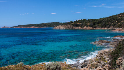 The Corsican coastline with its turquoise sea and blue sky