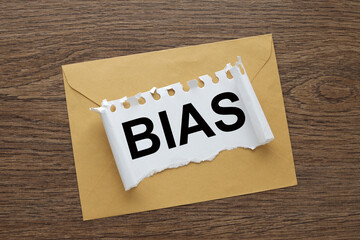 Bias - envelope on the desk.. text on torn paper