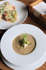 Traditional Ukrainian Russian borscht . Bowl of red beet root soup borsch with white cream . Beet Root delicious soup . Traditional Ukraine food cuisine