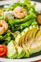 delicious fresh salad with shrimp, blue cheese and avocado