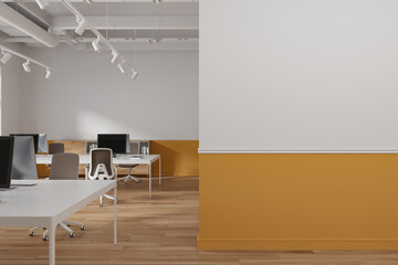 White and orange open space office with blank wall