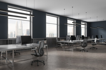 Blue office interior with desk and armchairs, sideboard near panoramic window