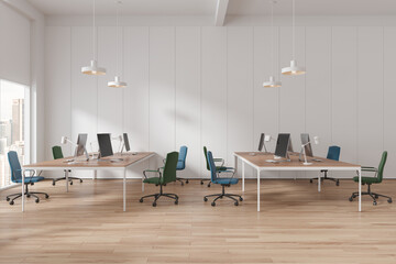 White office interior with pc monitors and desk near panoramic window