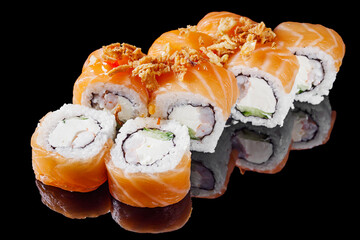 sushi roll with cream cheese salmon shrimp cucumber on a black mirror background