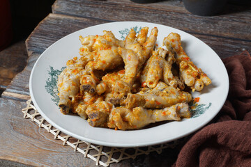 Chicken feet with spicy chili sauce or Ceker Ayam Mercon