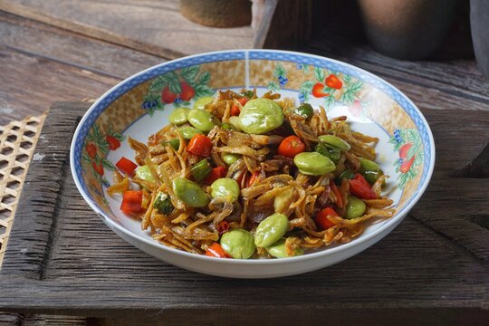 Malaysian dish dried anchovy with stink bean in hot chili sauce or Ikan Bilis Petai