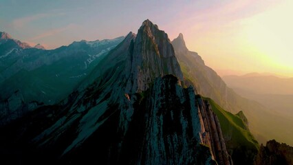 Schaeffler mountain ridge swiss Alpstein, Appenzell Switzerland, a steep ridge of the majestic Schaeffler peak, Switzerland. couple man and woman mid age in the mountains, man and woman hiking