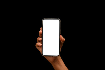 Hand holding smartphone isolated on black background. Empty screen for your text message or application design