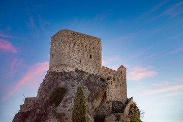 Imposing view of the medieval castle of Olvera, Cadiz, Andalusia, Spain, on top of a cliff