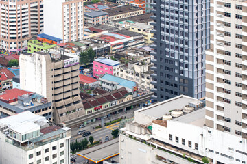 View of Kuala Lumpur from the upper floors of the skyscraper on cloudy day. Malaysia.