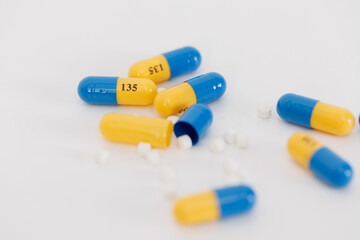Macro Shot of colour Pills and Capsules During Production and Packing Process on Modern Pharmaceutical Factory. Tablet and Capsule Manufacturing Process. Close-up Shot of Medical Drug Production Line.