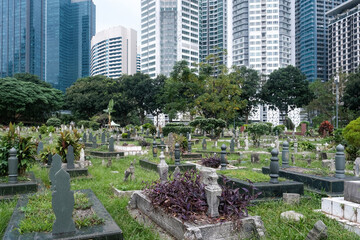View of Jalan Ampang Muslim Cemetery on cloudy day. Kuala Lumpur, Malaysia.
