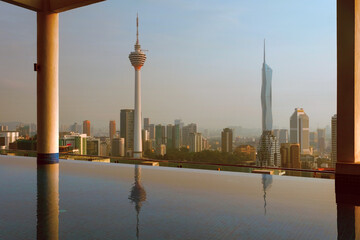 Swimming pool on the roof of skyscraper and panorama of the city with Kuala Lumpur and Merdeka 118...