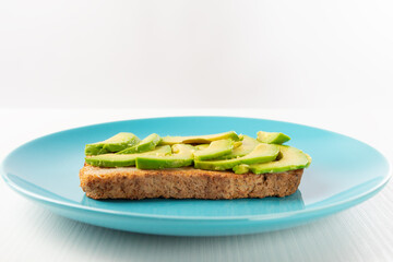 avocado toast, sliced avocado pieces on grain toasted bread