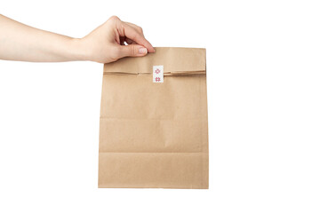 take away bag in hand isolated, grocery delivery, responsible lunch packaging