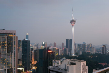 Fototapeta premium View of the city and Kuala Lumpur TV Tower at late blue hour. Kuala Lumpur, Malaysia.