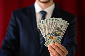 businessman holding money , dollars 5