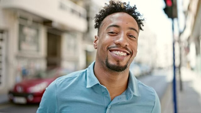 African american man smiling confident standing at street