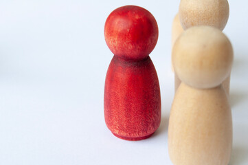 Leadership concept. Wooden figures on white background.