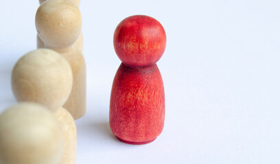 Leadership concept. Wooden figures on white background.