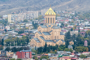 Fototapeta na wymiar View of Holy Trinity Cathedral on cloudy autumn day. Tbilisi, Georgia.