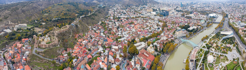 Panoramic drone view of Tbilisi on cloudy autumn day. Caucasus, Georgia.