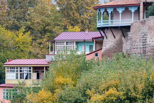View of traditional Georgian houses and fragment of Queen Darejan Palace on cloudy autumn day. Tbilisi, Georgia.