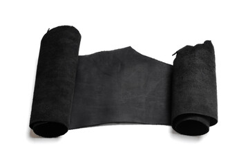 Black leather piece isolated on white background. Top view.