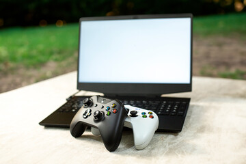 white computer screen with game controller