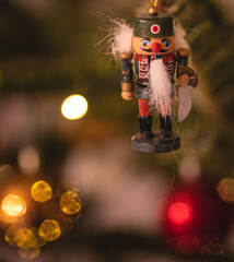 Vintage wooden toy doll with Christmas clothes, traditional figurine of Christmas time