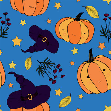 Cartoon seamless pattern of funny pumpkins in hats with stars on a blue background.