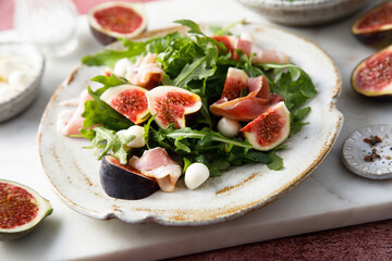 Arugula salad with figs and mozzarella cheese