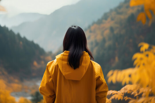 Back View of an Asian Woman on a Mountain