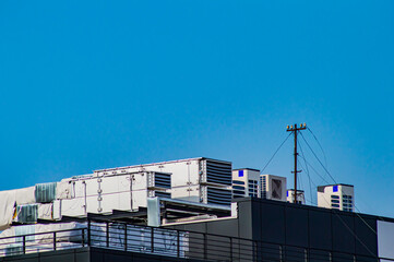 Industrial air conditioning and ventilation system on the roof of the building.