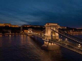 Fototapeta premium Aerial view about the freshly renovated Szechenyi Chain bridge with Buda castle at the background. Budapest aerial cityscape.