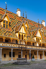 The Hospices de Beaune or H&ocirc;tel-Dieu de Beaune is a former charitable almshouse in Beaune, France