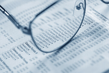 glasses on the documents closeup