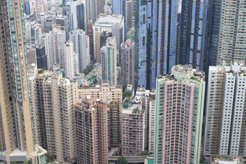 Fototapeta na wymiar High rise apartment buildings in Hong Kong densely packed together 