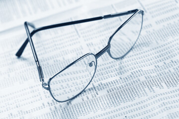 glasses on the documents closeup