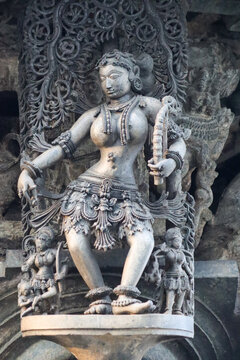 An Eye catching picture of the Sculpture carving of a Hindu Court Dancer in fine detail at the Belur Chennakeshava temple in Karnataka, India.